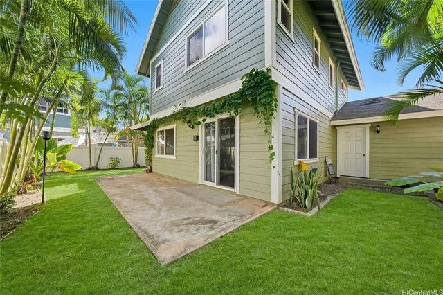 a front view of a house with a yard and porch