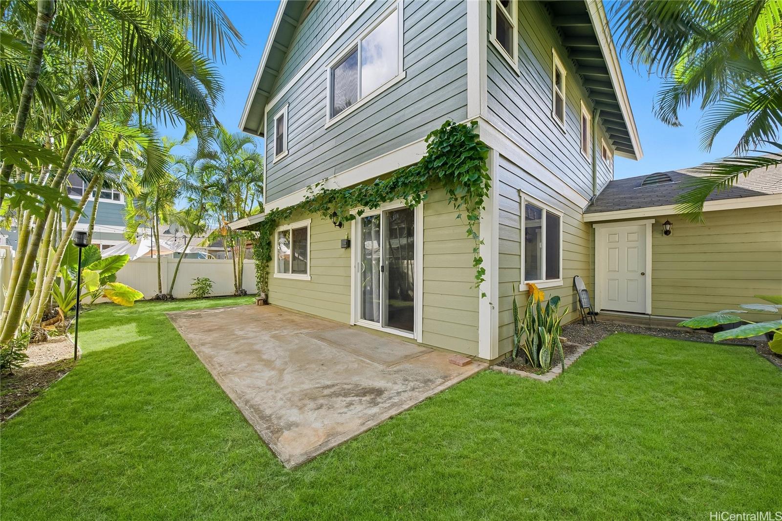 87-1958 Pakeke Street, Unit T Waianae, HI 96792 - Photo 23 of 25 a front view of a house with a yard and porch