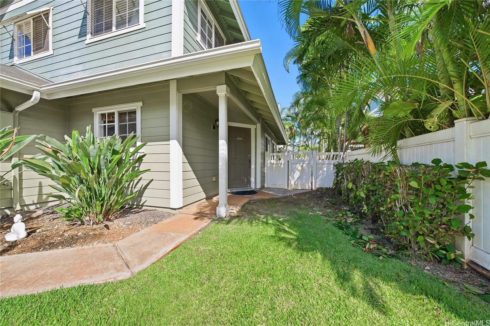 87-1958 Pakeke Street, Unit T Waianae, HI 96792 - Photo 3 of 25 a view of a house with a yard and plants