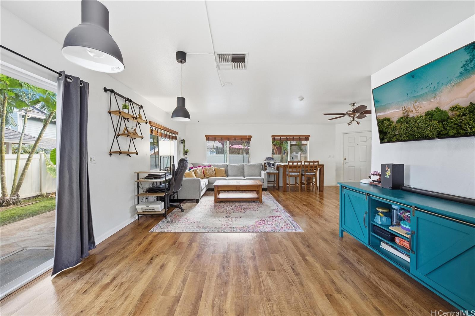 87-1958 Pakeke Street, Unit T Waianae, HI 96792 - Photo 5 of 25 a living room with furniture and a flat screen tv