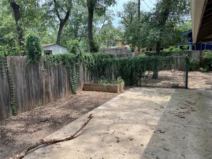 a backyard of a house with lots of trees