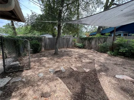 a backyard of a house with lots of green space