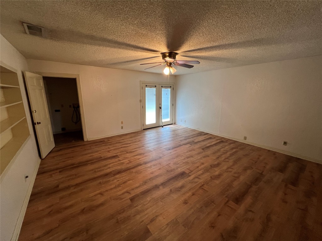 1200 Bentwood Road Austin, TX 78722 - Photo 4 of 16 wooden floor in an empty room