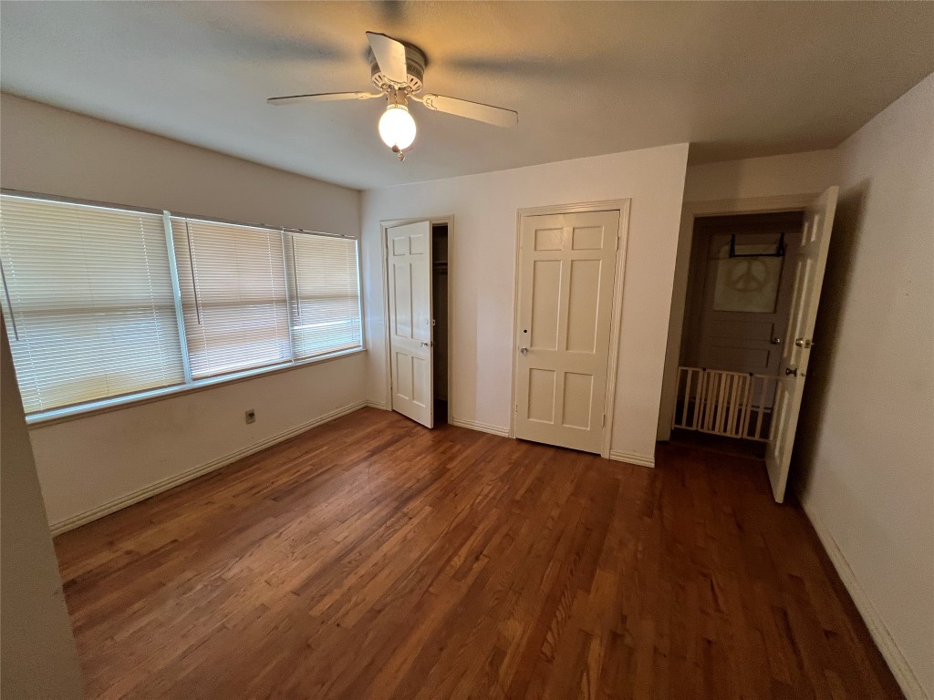 1200 Bentwood Road Austin, TX 78722 - Photo 7 of 16 wooden floor in an empty room with a window