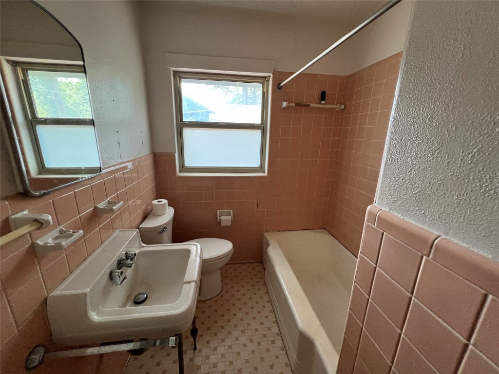 1200 Bentwood Road Austin, TX 78722 - Photo 9 of 16 a bathroom with sink and window