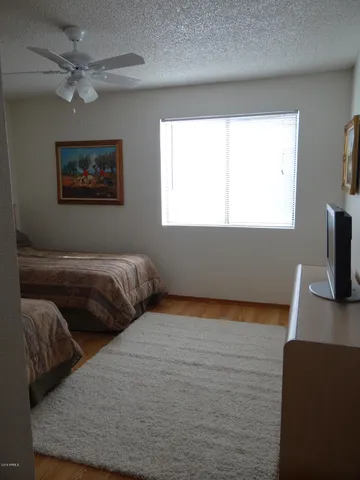a bedroom with bed and window