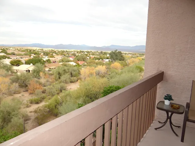 a view of city and mountain from a balcony