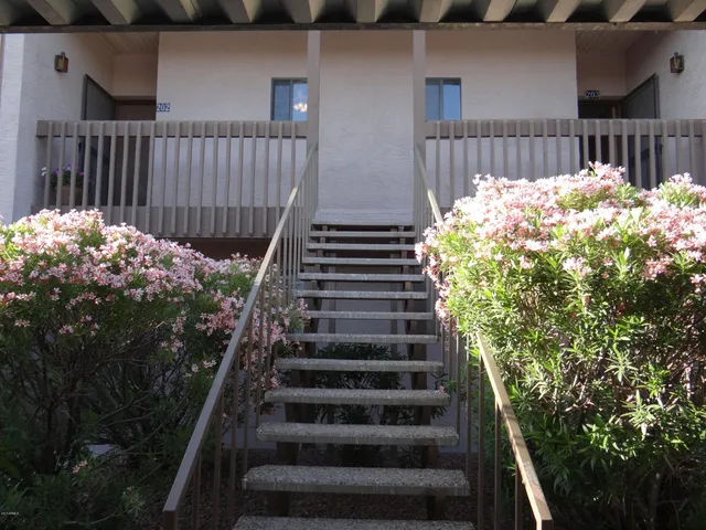 a view of stairs and flowers
