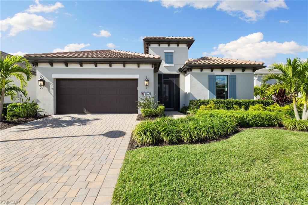 3967 Pegasus Way Naples, FL 34120 - Photo 34 of 50 a front view of a house with a garden