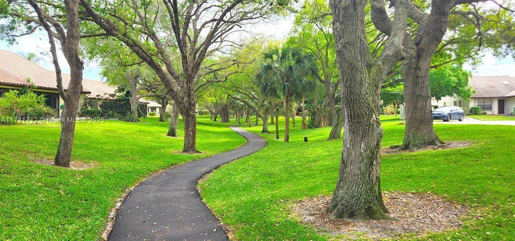 3355 Jaywood Terrace, Unit J113 Boca Raton, FL 33431 - Photo 19 of 34 a view of a park with a tree