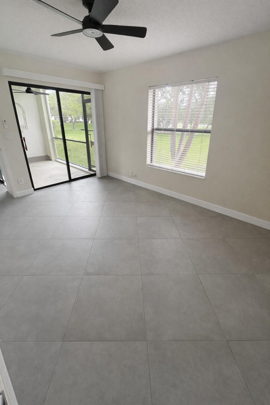 3355 Jaywood Terrace, Unit J113 Boca Raton, FL 33431 - Photo 8 of 34 a view of an empty room with a window
