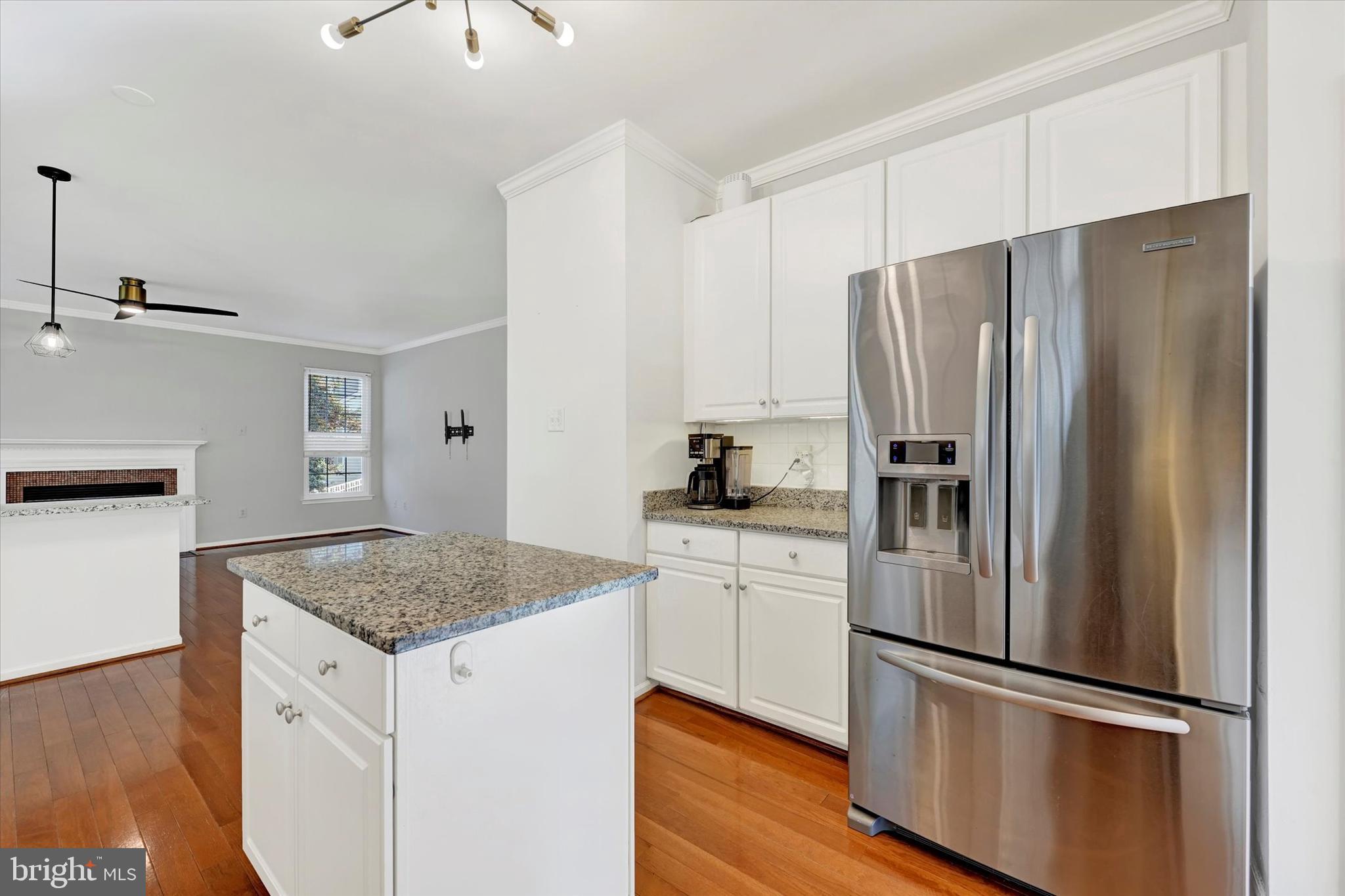 1590 Chapman Road Crofton, MD 21054 - Photo 12 of 70 a kitchen with granite countertop stainless steel appliances a refrigerator and stove