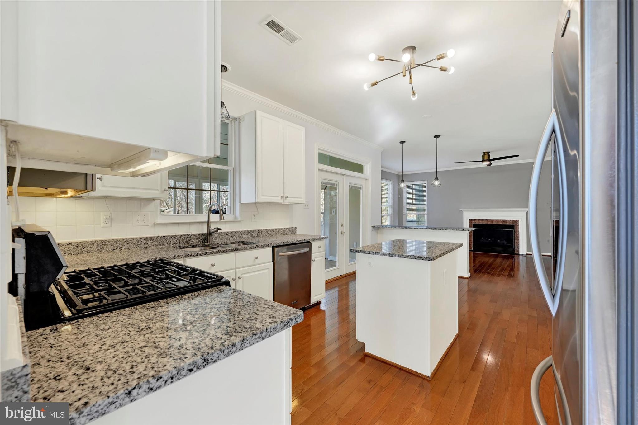 1590 Chapman Road Crofton, MD 21054 - Photo 13 of 70 a kitchen with a stove a refrigerator and a sink