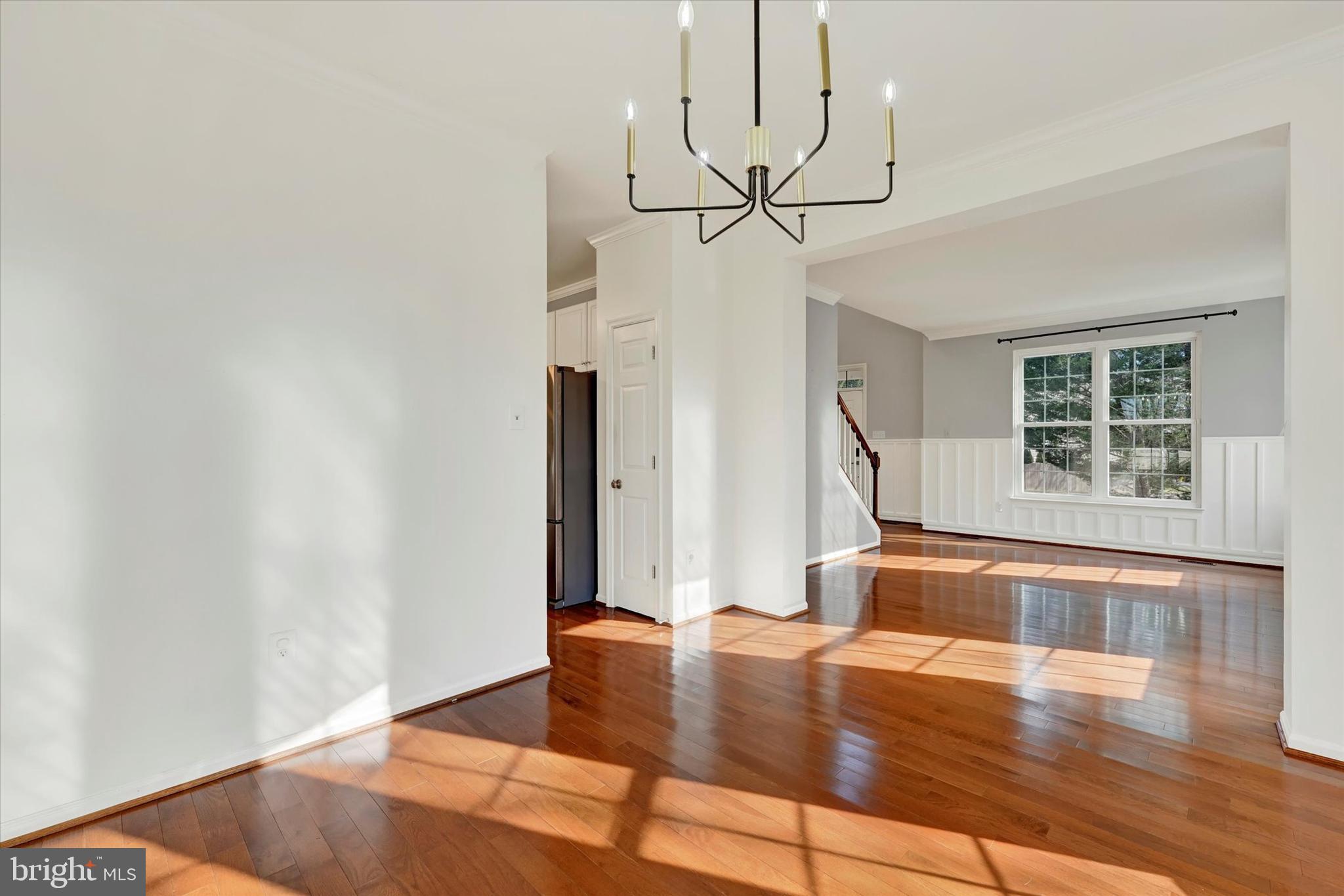 1590 Chapman Road Crofton, MD 21054 - Photo 14 of 70 a view of a livingroom with wooden floor and staircase