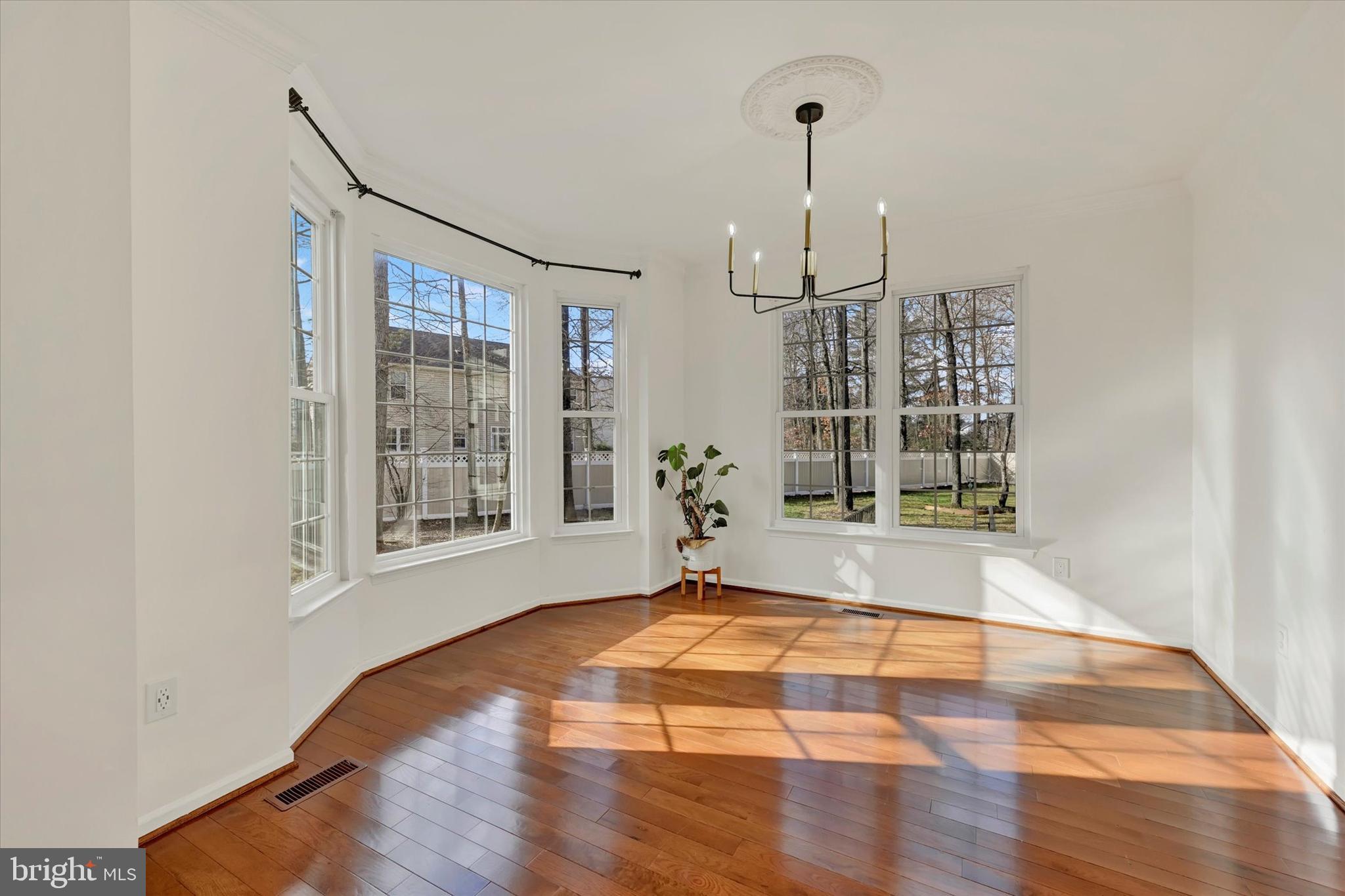 1590 Chapman Road Crofton, MD 21054 - Photo 15 of 70 a view of an empty room with a window and wooden floor