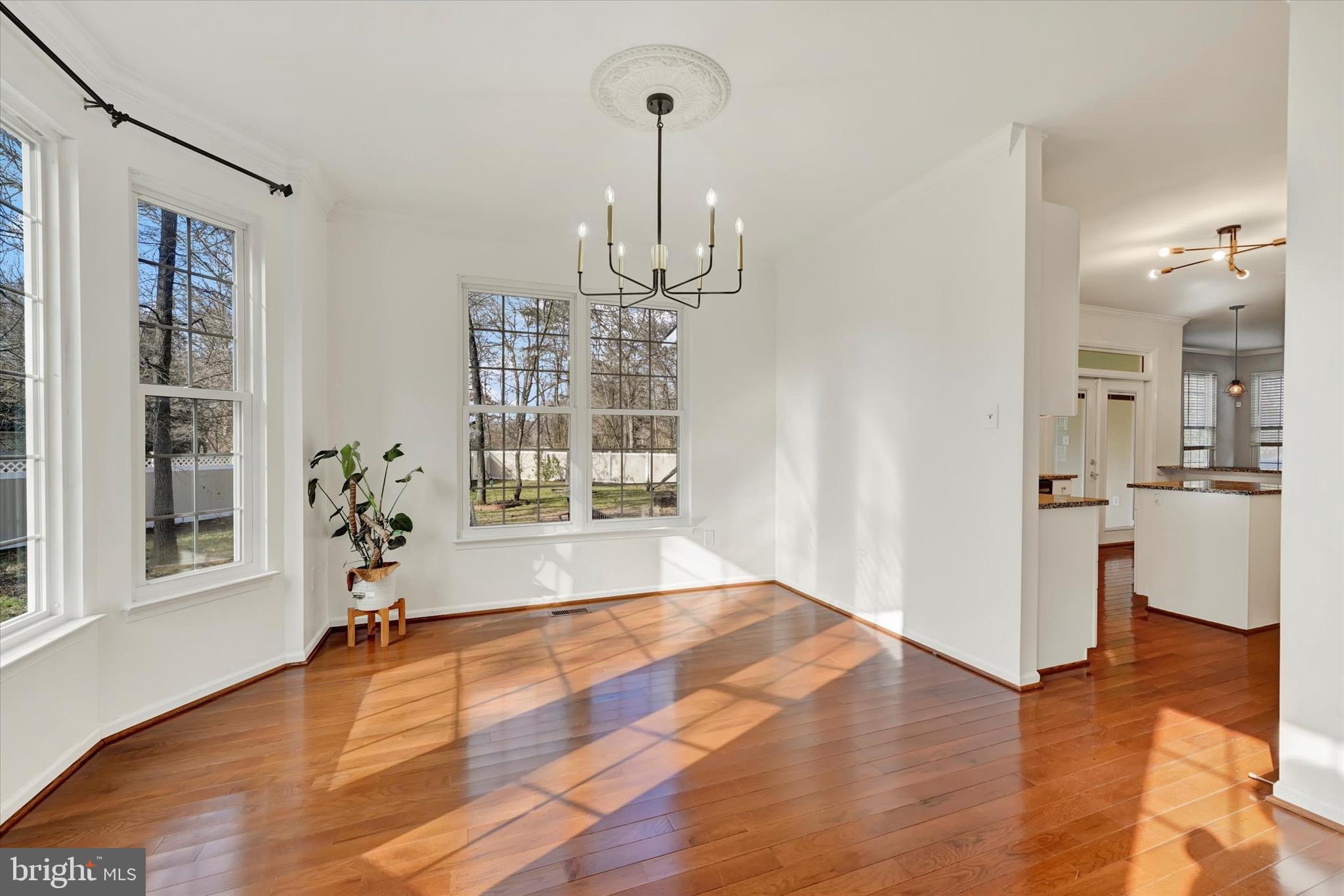 1590 Chapman Road Crofton, MD 21054 - Photo 16 of 70 a view of empty room with wooden floor and large window