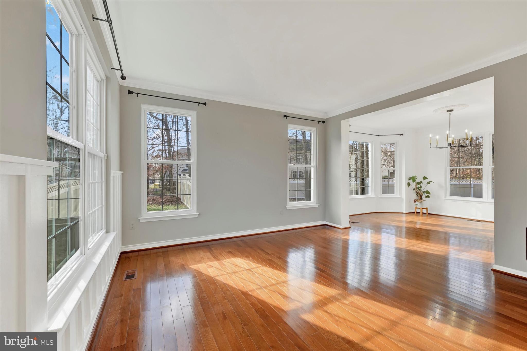 1590 Chapman Road Crofton, MD 21054 - Photo 18 of 70 a view of an empty room with wooden floor and a window
