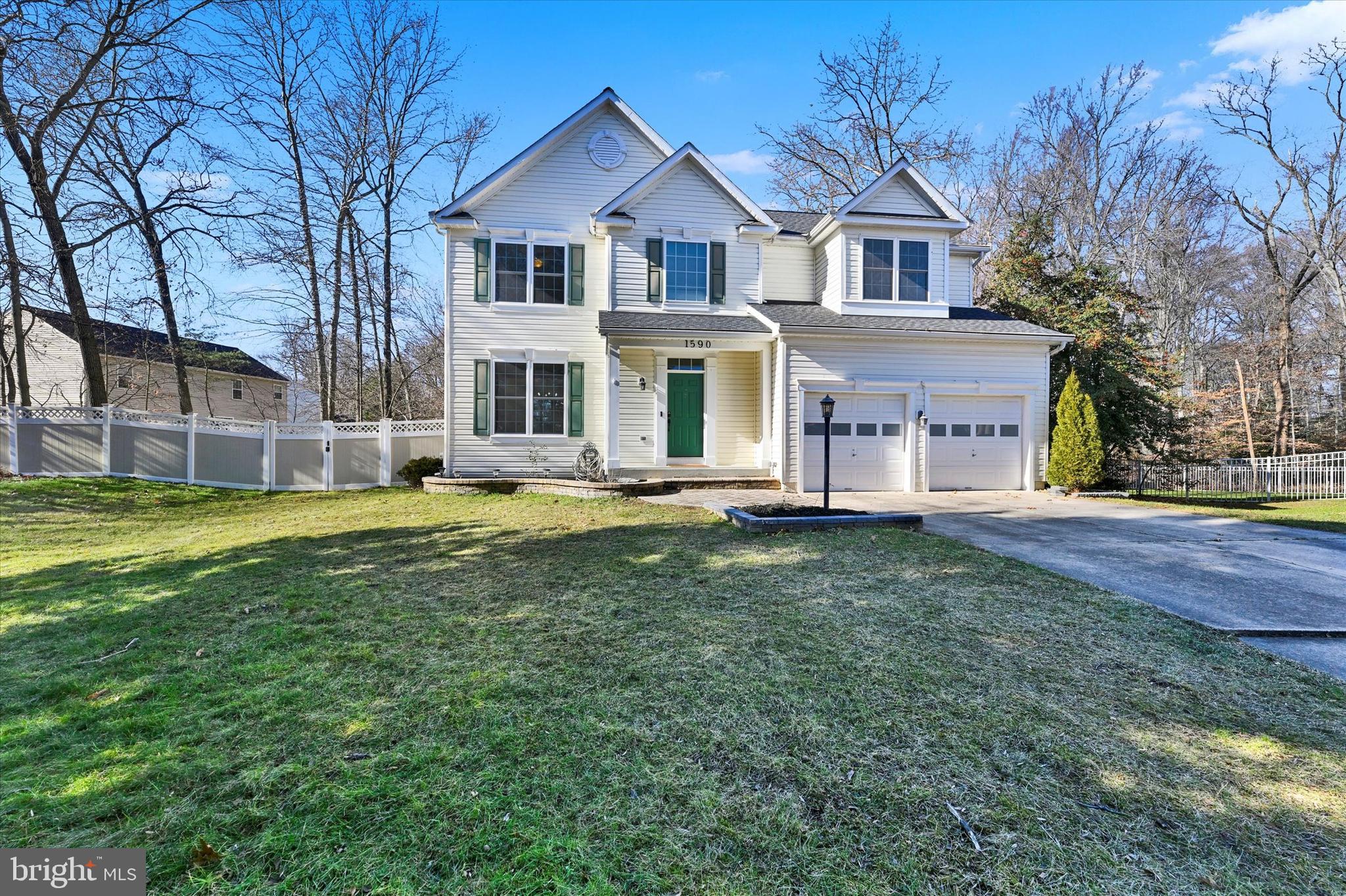 1590 Chapman Road Crofton, MD 21054 - Photo 2 of 70 a front view of a house with a yard