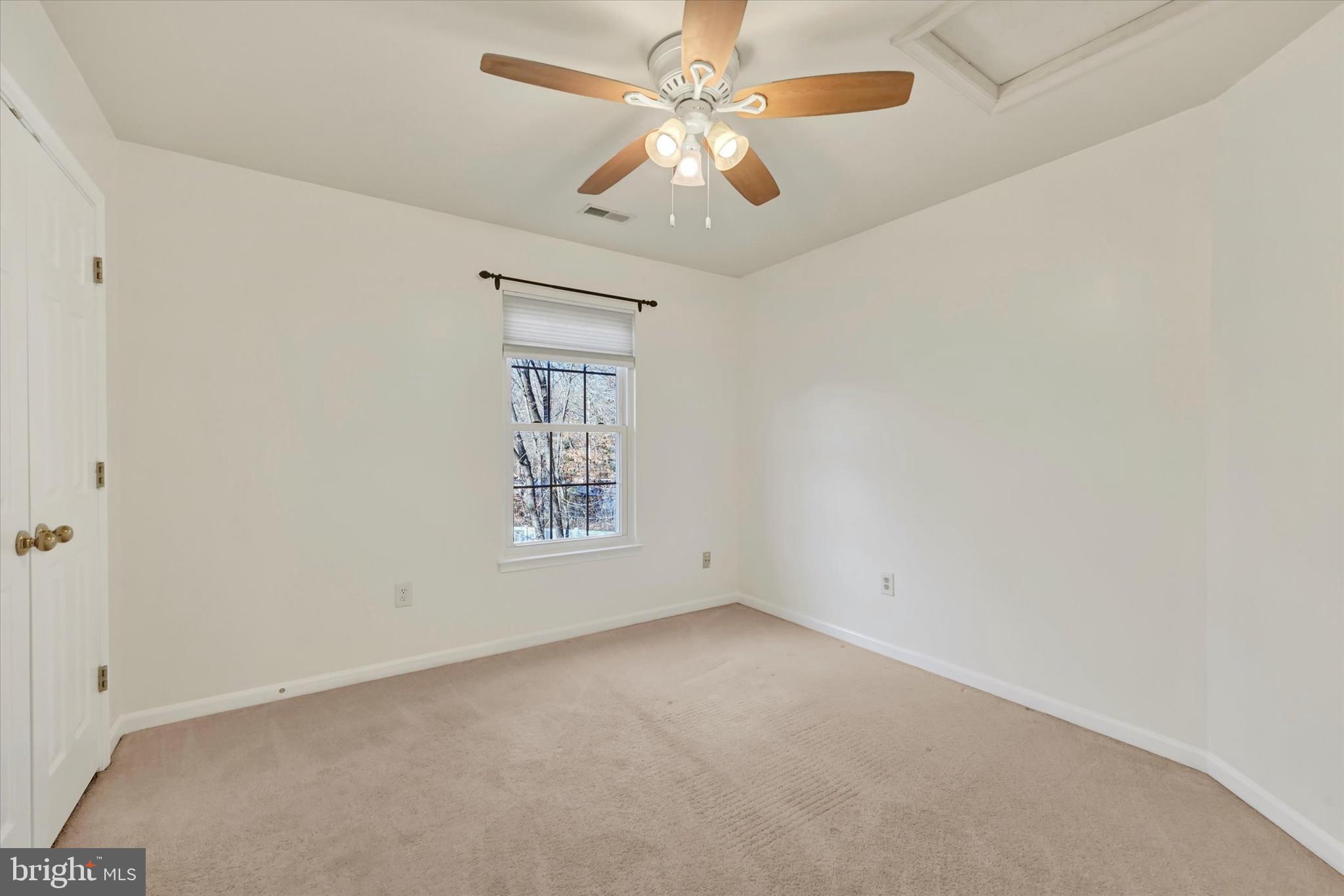 1590 Chapman Road Crofton, MD 21054 - Photo 27 of 70 an empty room with windows and fan