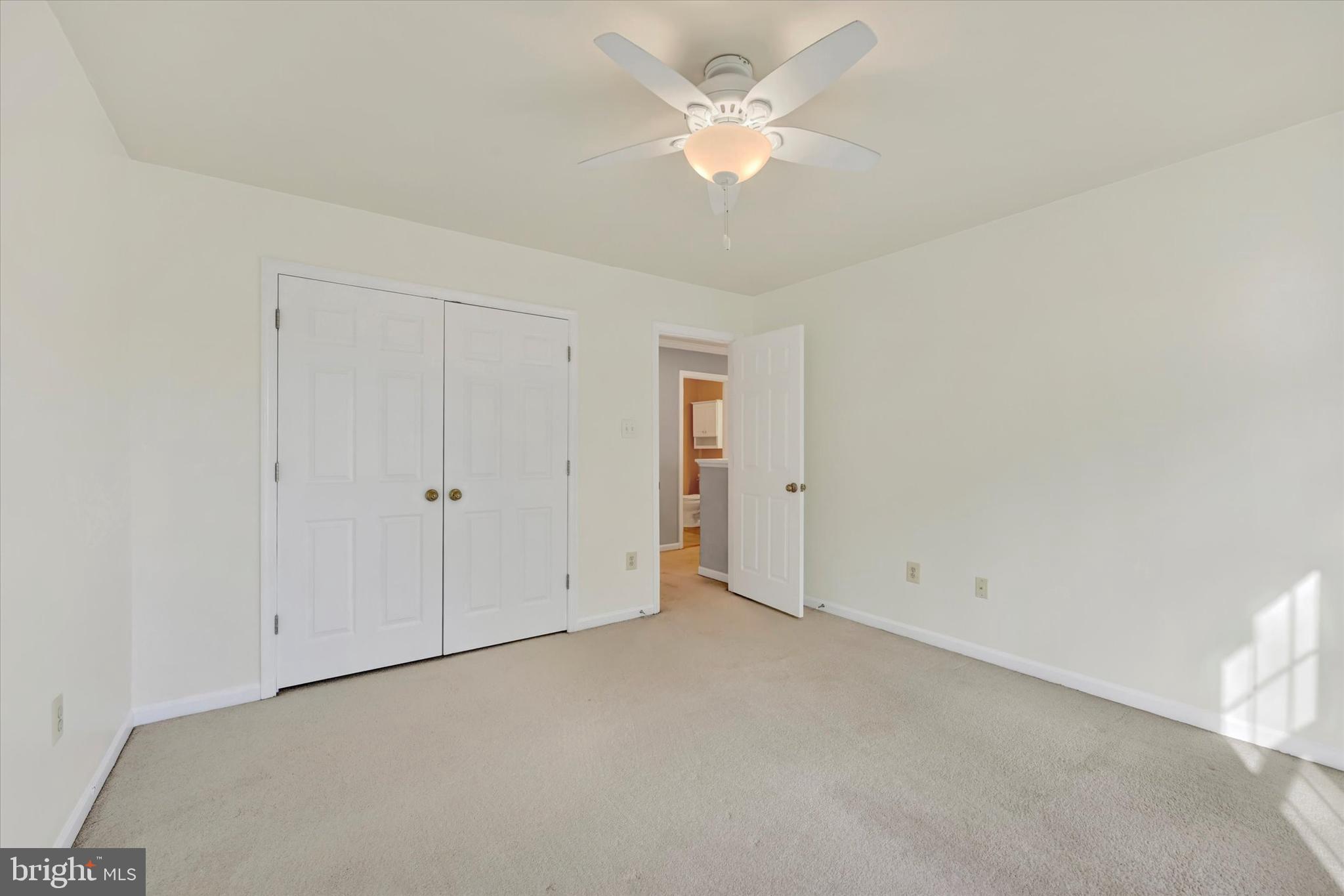 1590 Chapman Road Crofton, MD 21054 - Photo 31 of 70 an empty room with a ceiling fan and a window