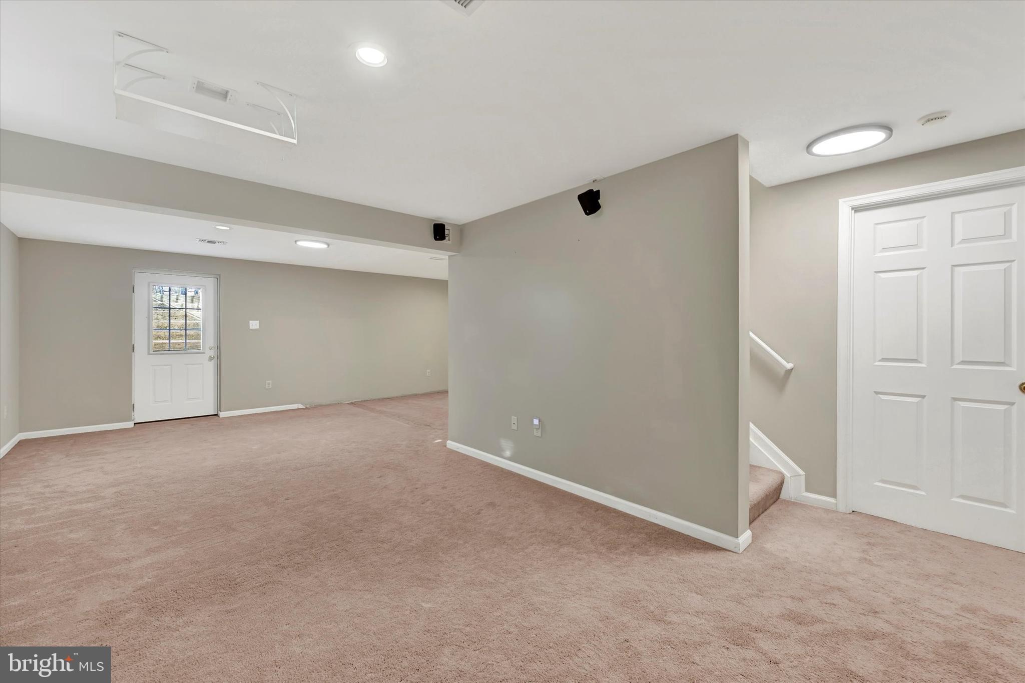 1590 Chapman Road Crofton, MD 21054 - Photo 33 of 70 an empty room with windows and entrance to other room