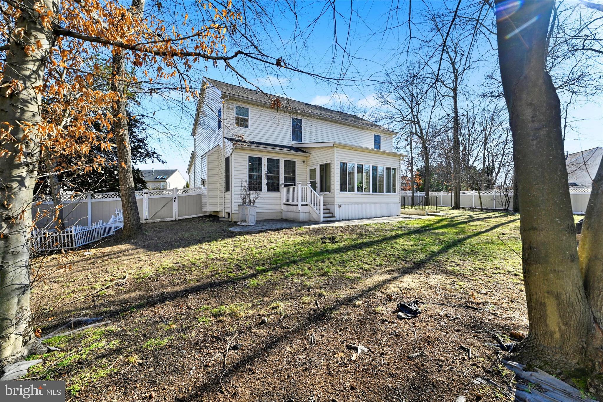 1590 Chapman Road Crofton, MD 21054 - Photo 39 of 70 a front view of a house with a yard and large trees