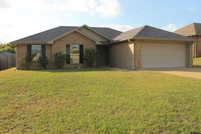 a kitchen with a sink and a refrigerator