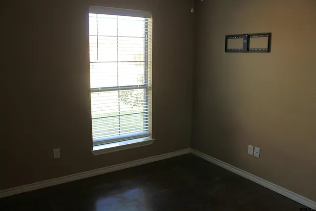 a view of a room with shelves on the wall