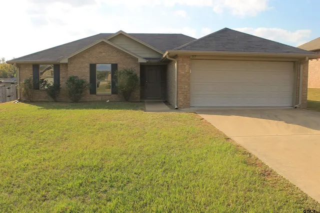 a kitchen with a sink and a refrigerator