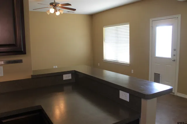 a view of a kitchen with a sink