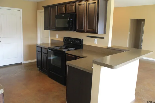 a view of a kitchen with a sink