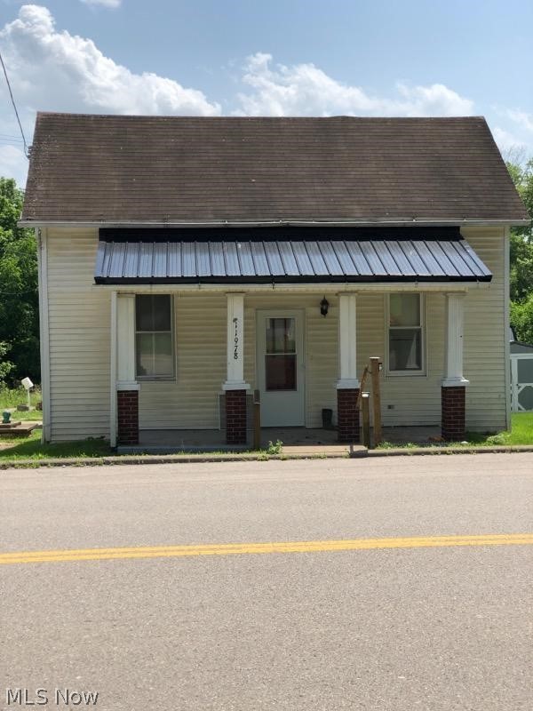 11978 Clay Pike Road Buffalo, OH 43772 - Photo 1 of 6 View of front facade featuring a porch