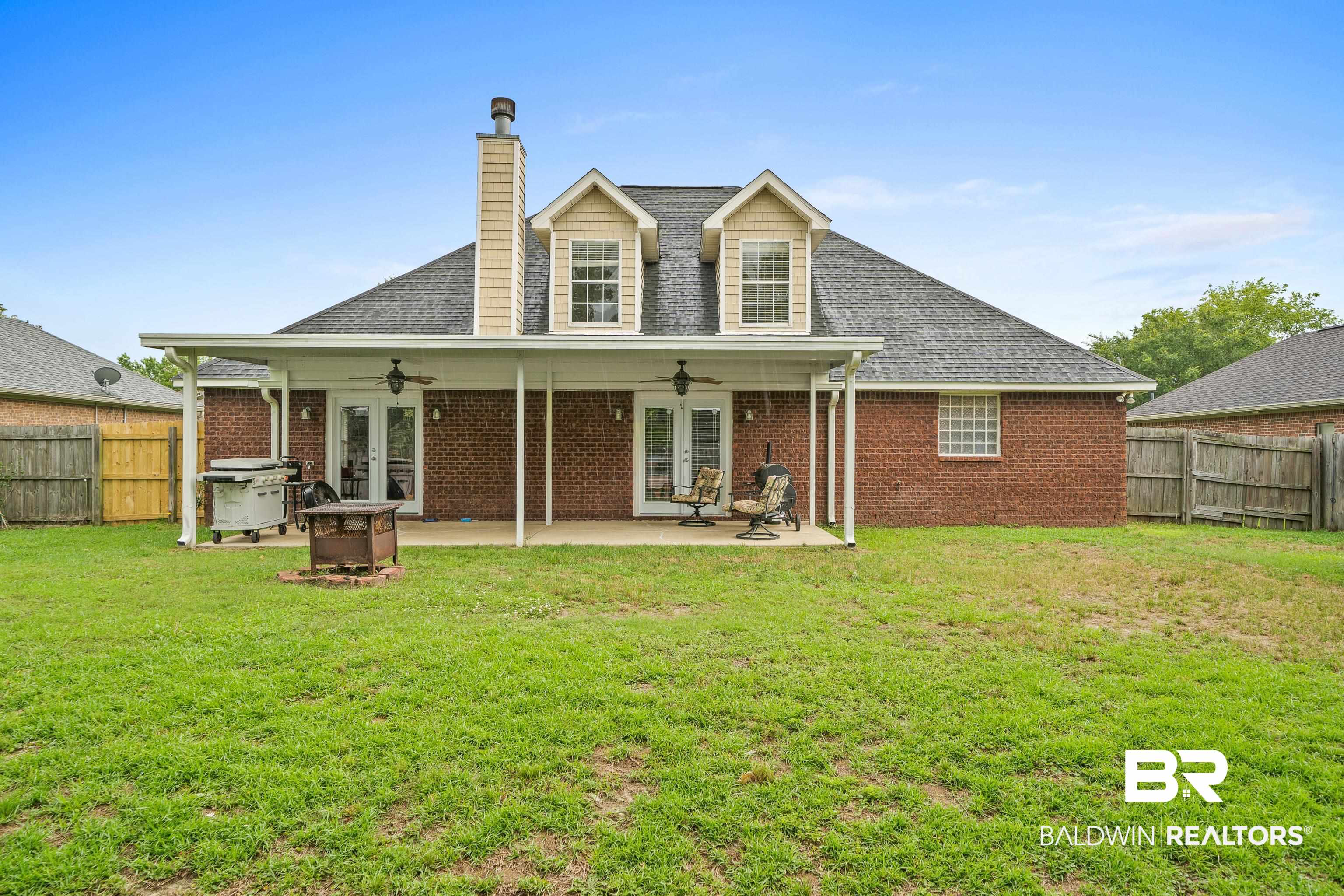 9552 Collier Loop Daphne, AL 36526 - Photo 28 of 28 Rear view of house with french doors, ceiling fan, a chimney, a patio, and a newer shingled roof