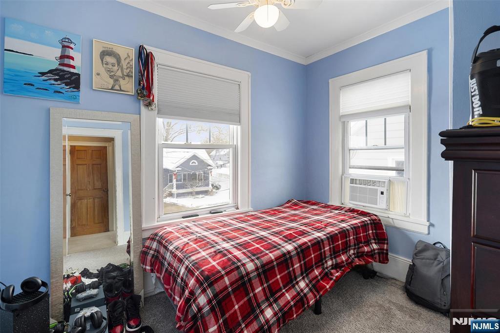 75 Pine Street Hackensack, NJ 07601 - Photo 14 of 23 a bedroom with a bed and a window