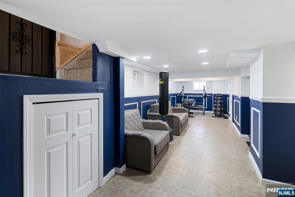 75 Pine Street Hackensack, NJ 07601 - Photo 19 of 23 a living room with furniture and a flat screen tv