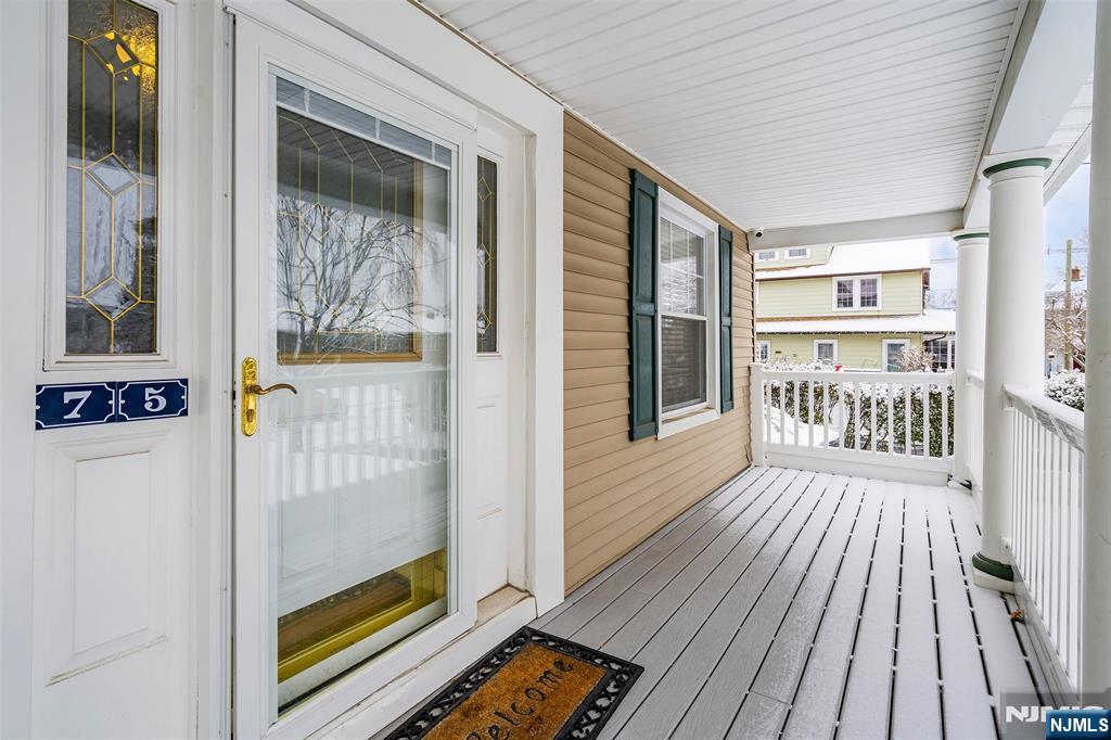 75 Pine Street Hackensack, NJ 07601 - Photo 3 of 23 a view of a hallway with wooden floor and furniture
