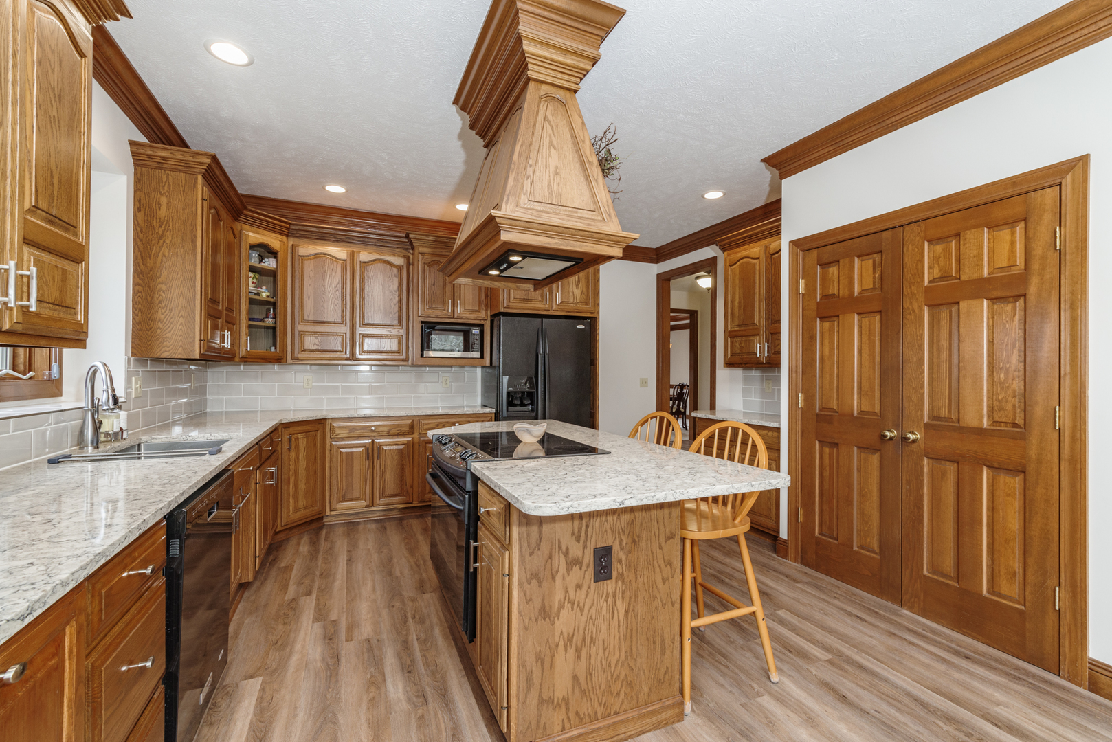 1908 Hackberry Road Bloomington, IL 61704 - Photo 17 of 50 a kitchen with a sink a counter top space and stainless steel appliances