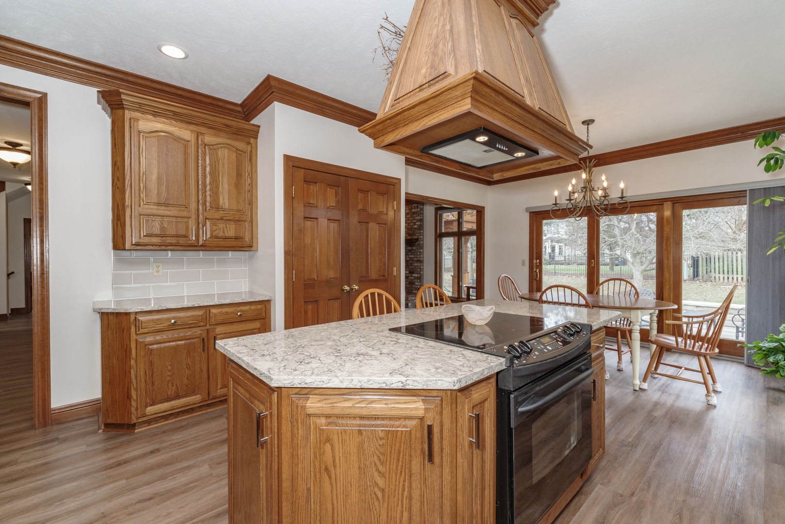 1908 Hackberry Road Bloomington, IL 61704 - Photo 18 of 50 a kitchen with granite countertop a stove and cabinets