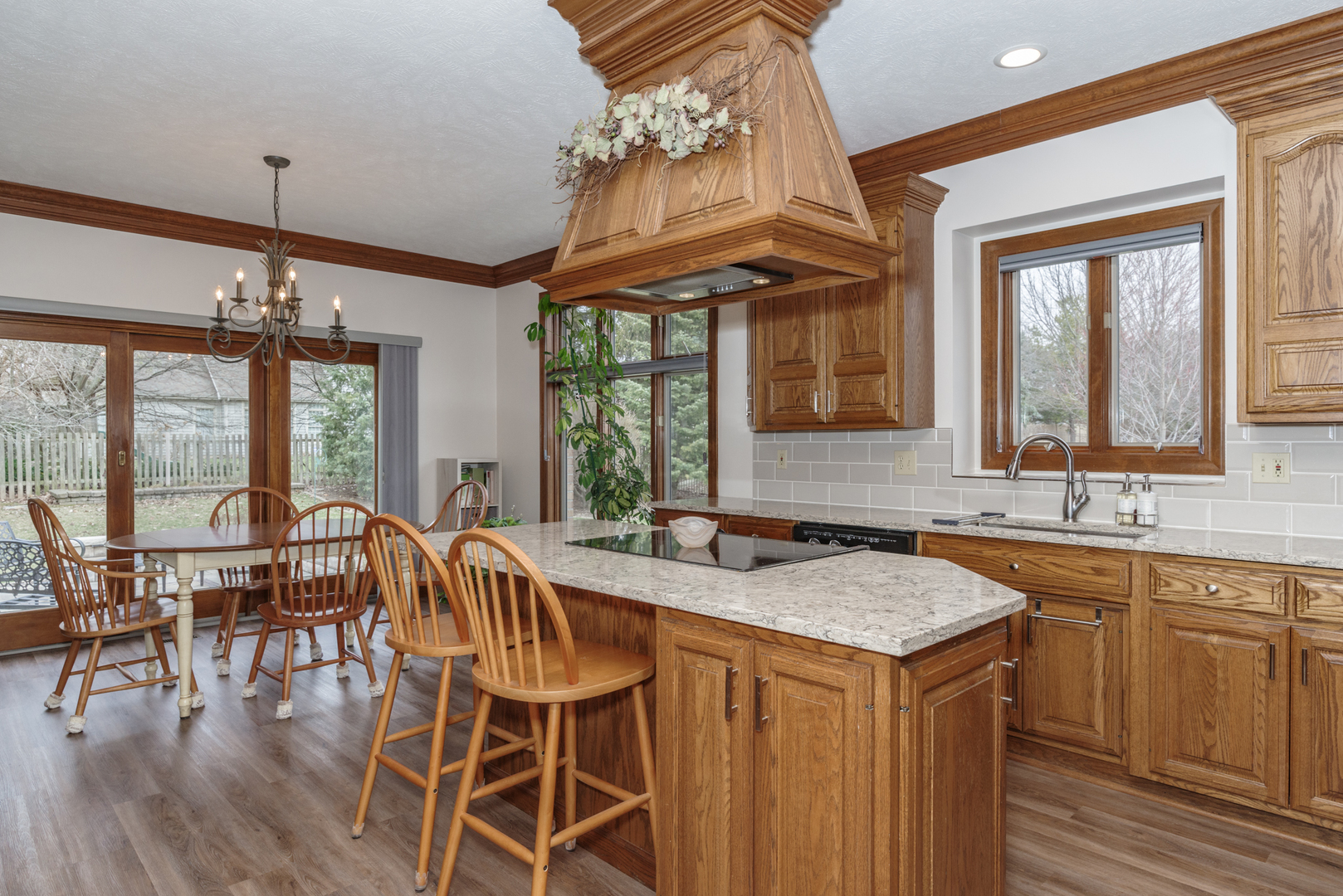 1908 Hackberry Road Bloomington, IL 61704 - Photo 19 of 50 a view of a dining room with furniture wooden floor and chandelier