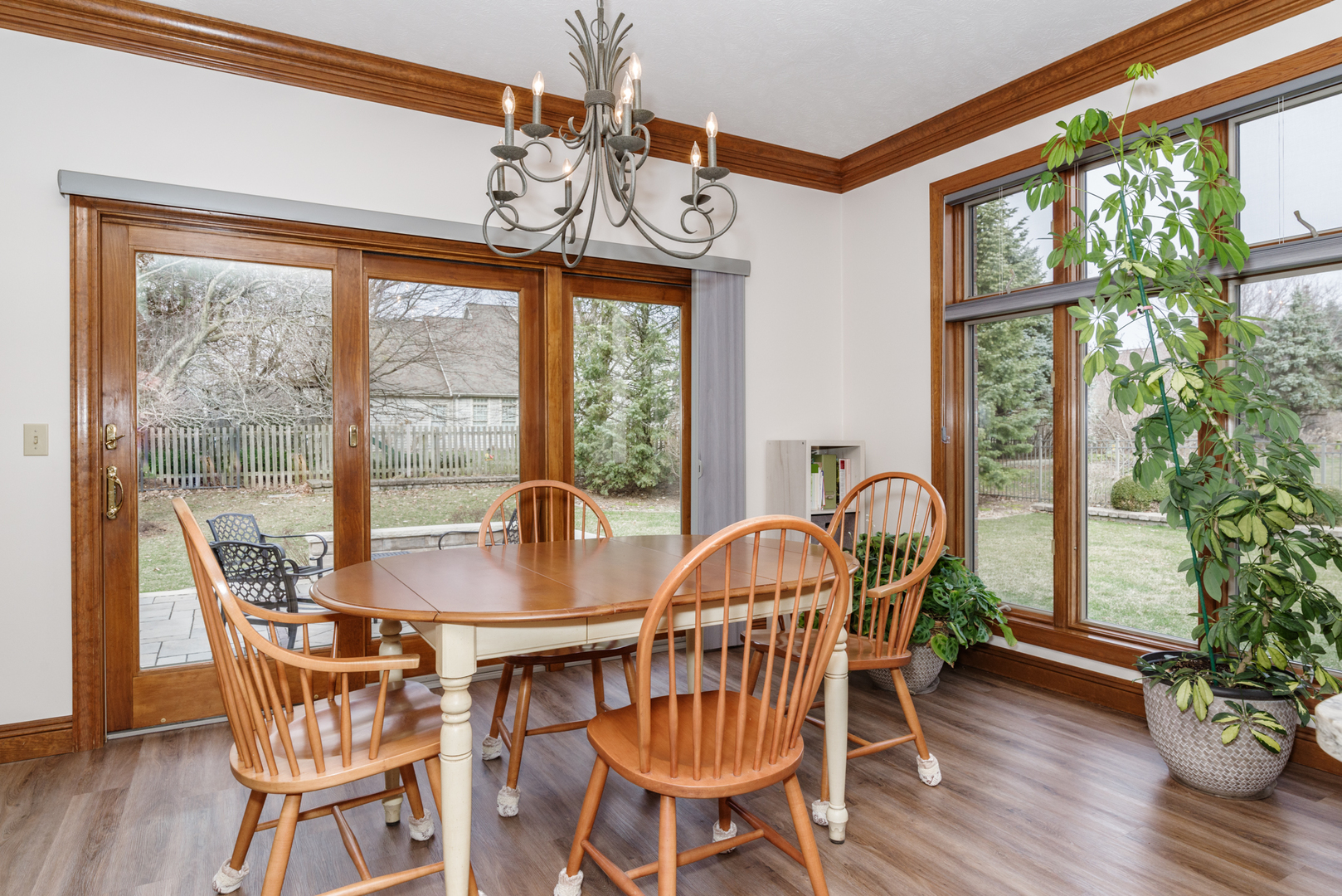 1908 Hackberry Road Bloomington, IL 61704 - Photo 20 of 50 a dining room with furniture a chandelier and wooden floor