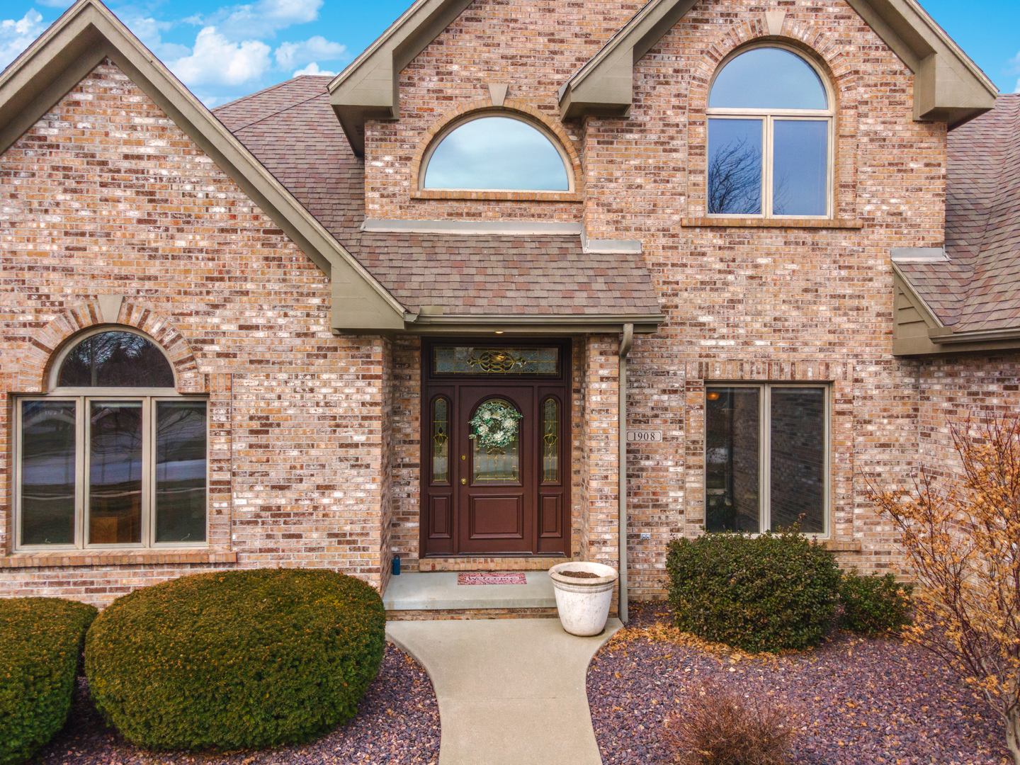 1908 Hackberry Road Bloomington, IL 61704 - Photo 2 of 50 a front view of a house with garden