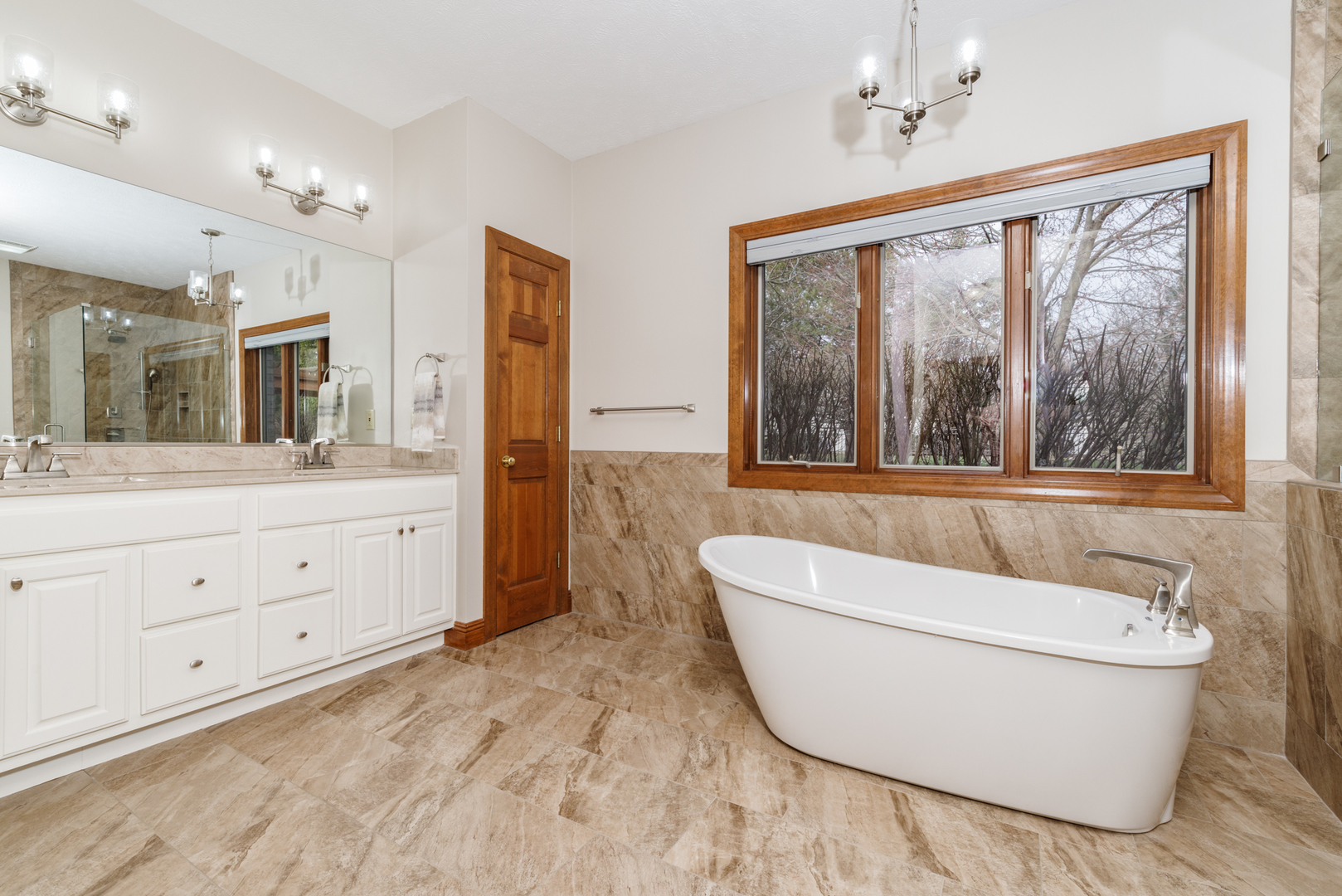 1908 Hackberry Road Bloomington, IL 61704 - Photo 24 of 50 a bathroom with a granite countertop sink mirror and bathtub