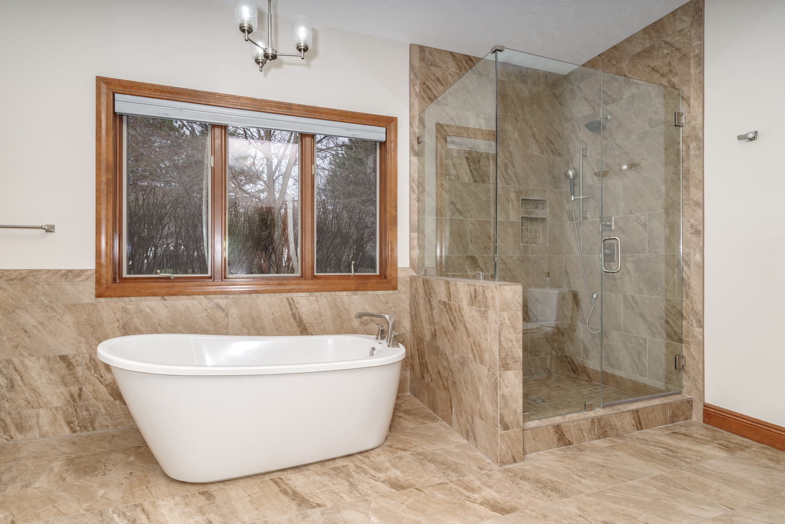 1908 Hackberry Road Bloomington, IL 61704 - Photo 25 of 50 a white tub sitting next to a shower