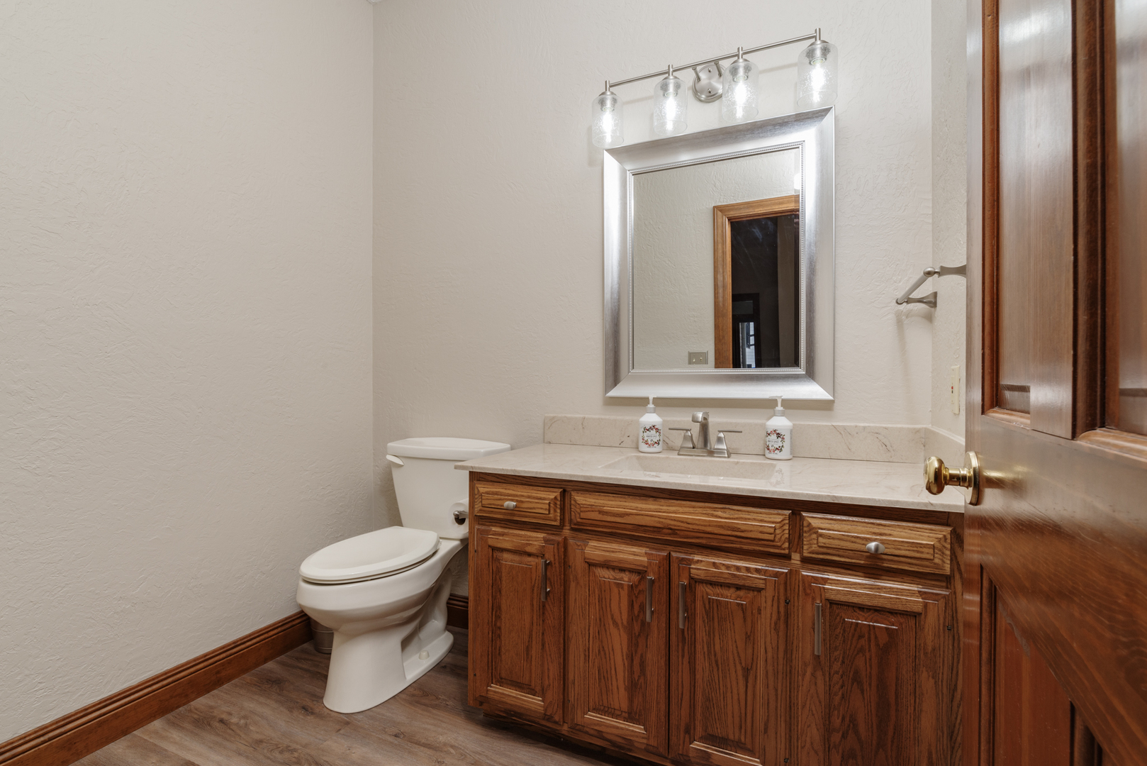 1908 Hackberry Road Bloomington, IL 61704 - Photo 28 of 50 a bathroom with a toilet sink and mirror