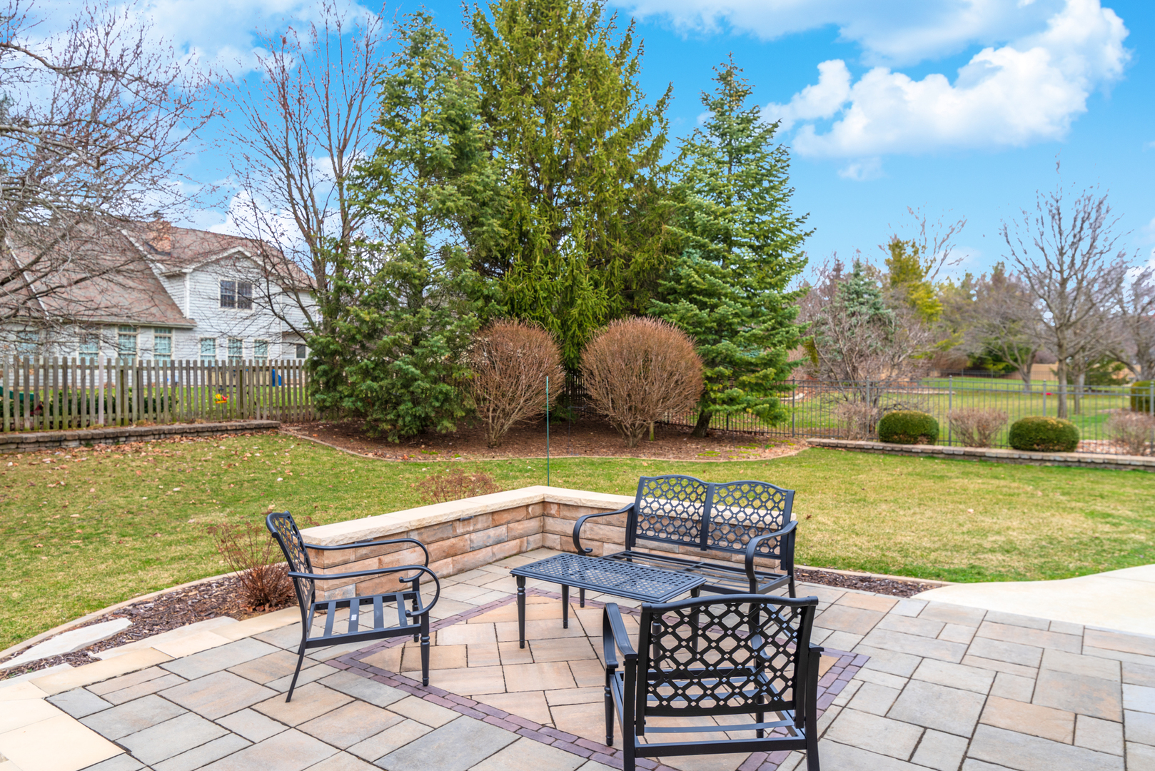 1908 Hackberry Road Bloomington, IL 61704 - Photo 45 of 50 a patio with glass top table and chairs