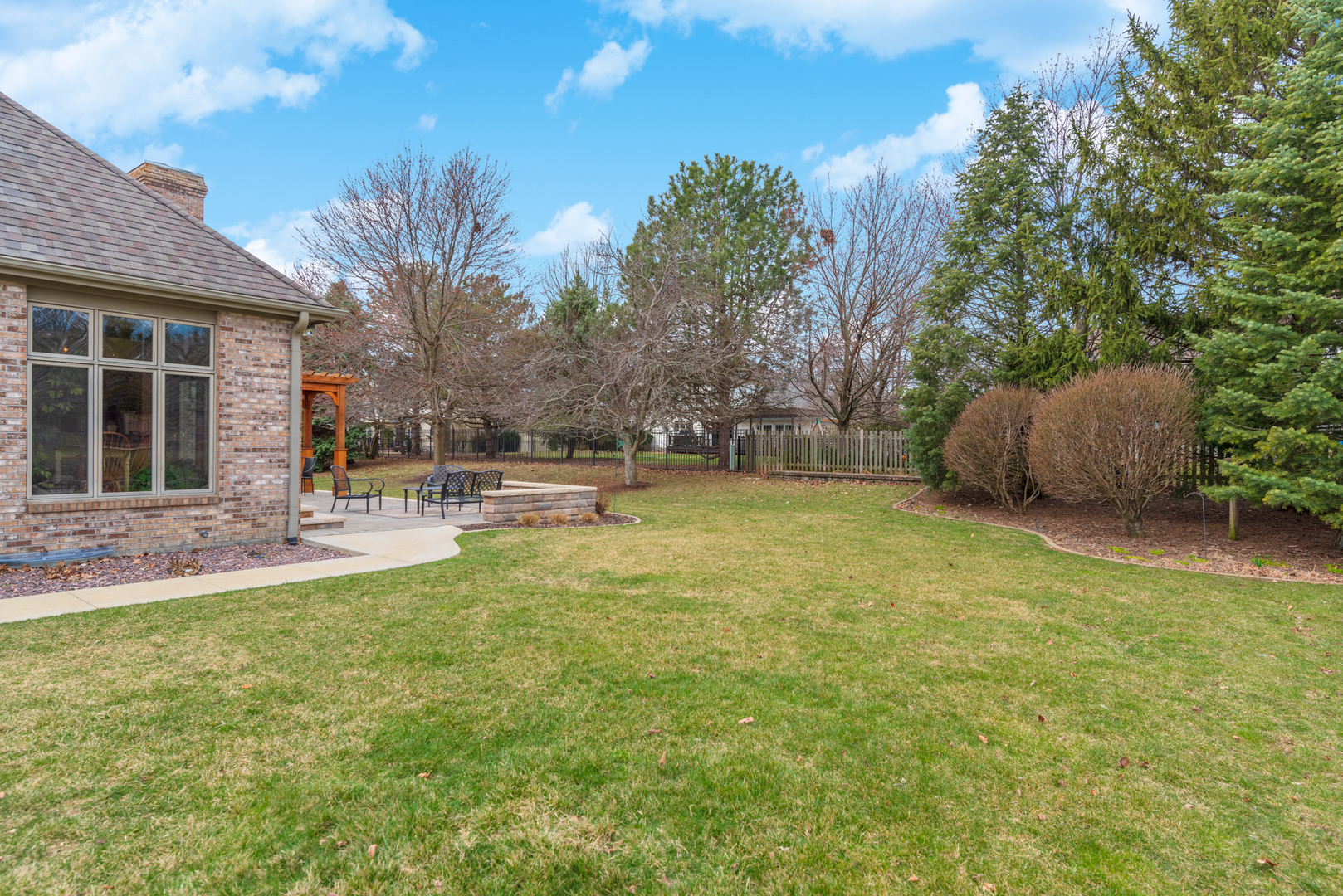 1908 Hackberry Road Bloomington, IL 61704 - Photo 50 of 50 a backyard of a house with table and chairs