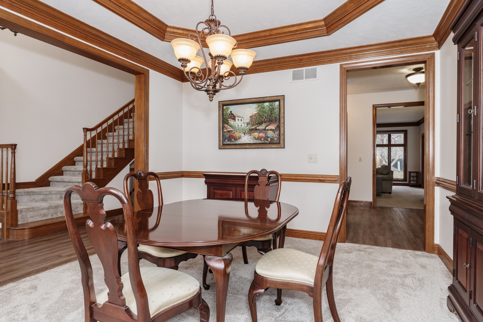 1908 Hackberry Road Bloomington, IL 61704 - Photo 8 of 50 a view of a dining room with furniture and a chandelier