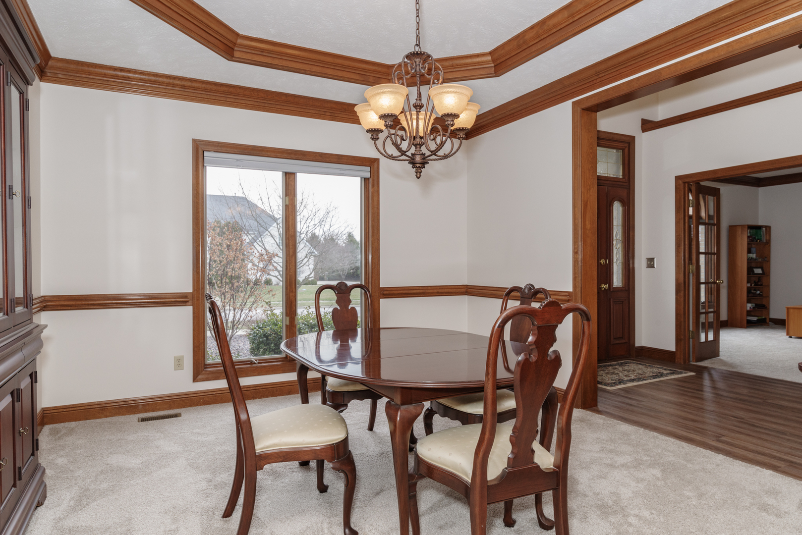 1908 Hackberry Road Bloomington, IL 61704 - Photo 9 of 50 a view of a dining room with furniture window and wooden floor