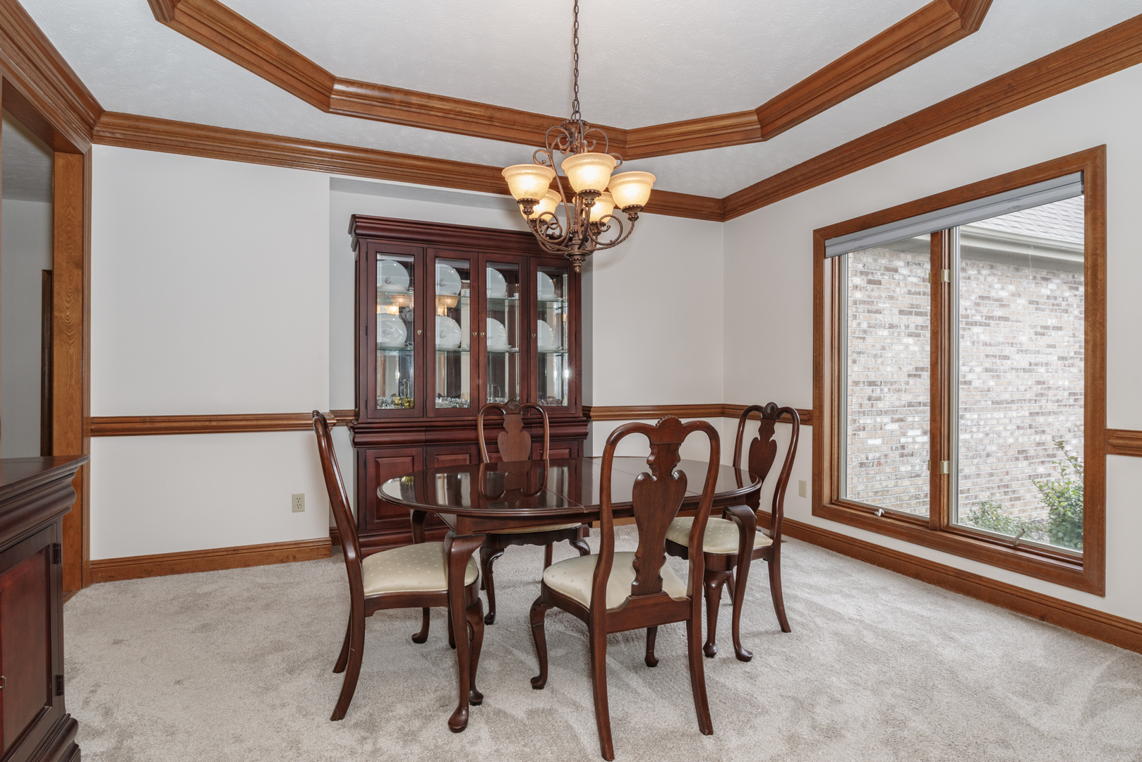 1908 Hackberry Road Bloomington, IL 61704 - Photo 10 of 50 a view of a dining room with furniture window and wooden floor