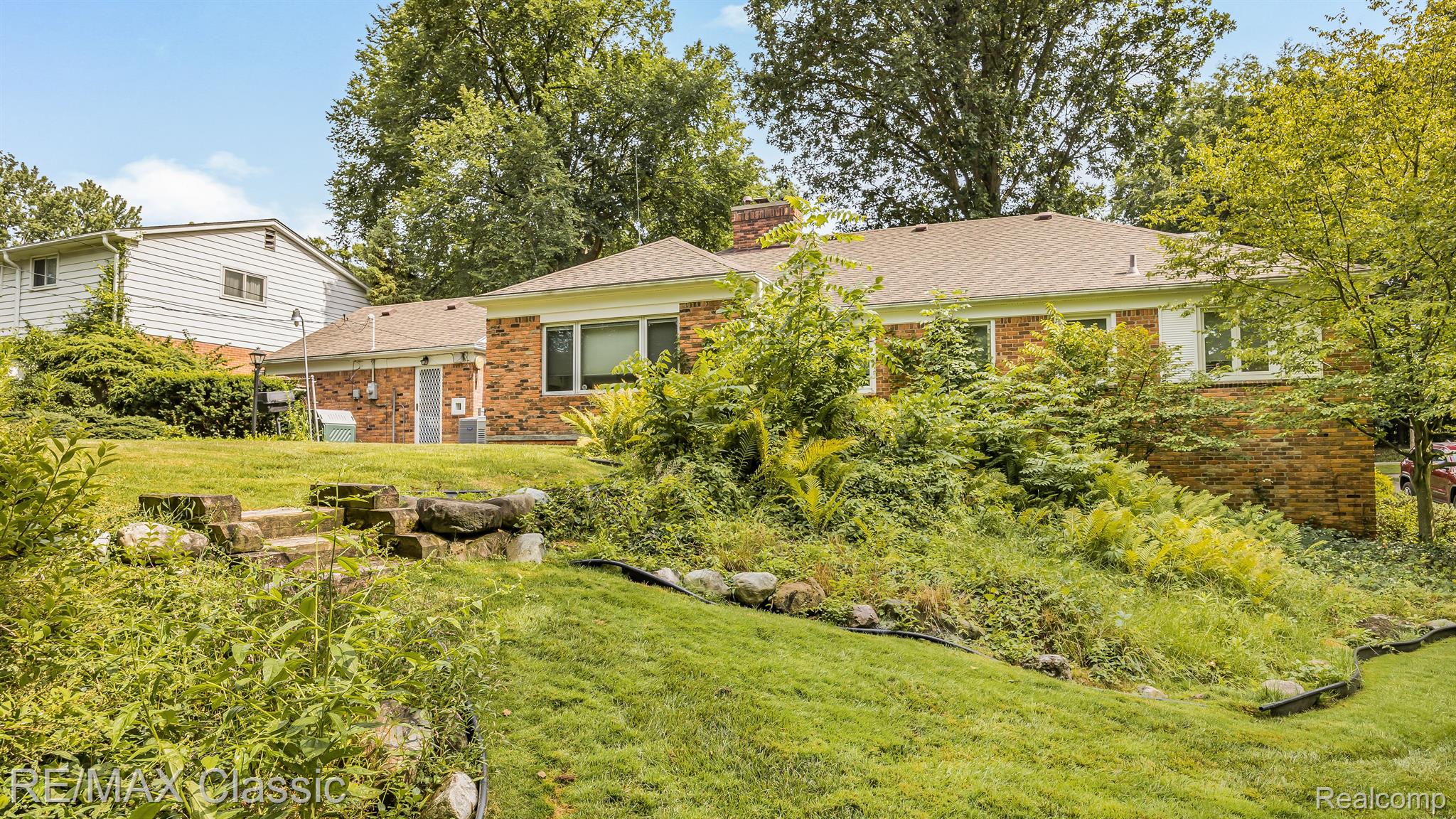 27256 Meadowbrook Road Redford, MI 48239 - Photo 54 of 62 Sloped back yard with mature landscaping